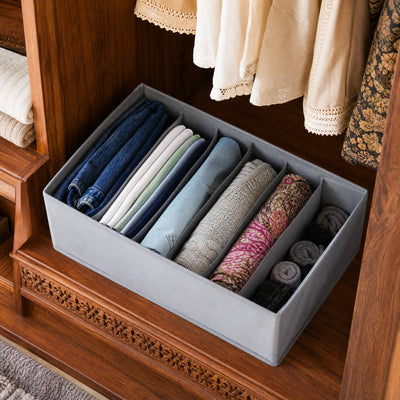Wardrobe shelf with 6-grid organizer keeping clothes upright